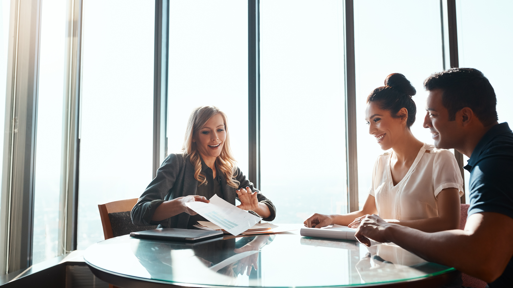 stock image of a financial advisor talking to clients