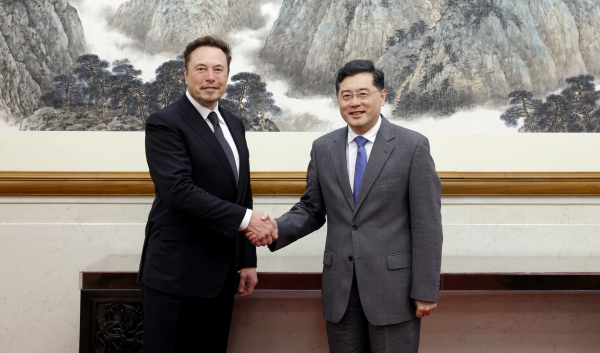 Musk holding hands with Qin Gang, China's Minister of Foreign Affairs